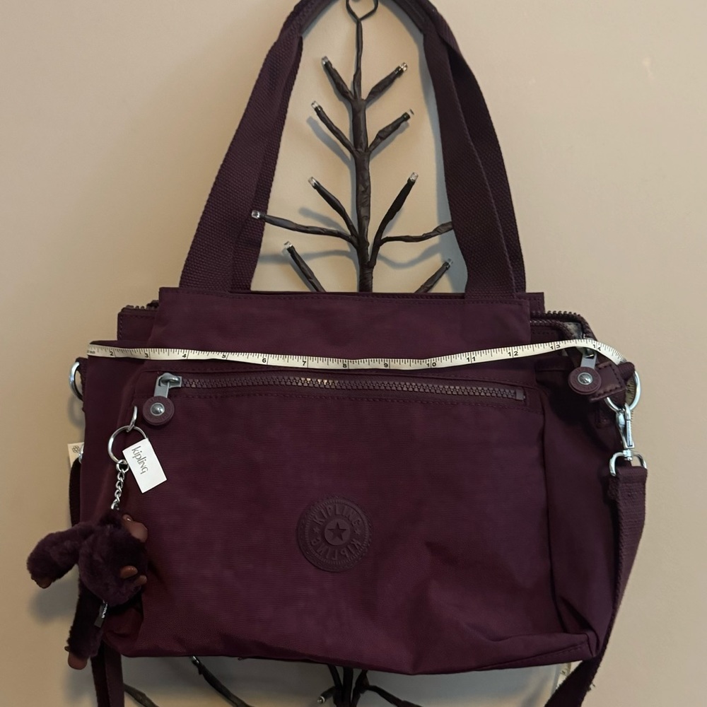 Brand new “Kipling “shoulder bag for women.Color-dark plum tonal.Size-14”x10”💜 - Picture 10 of 11